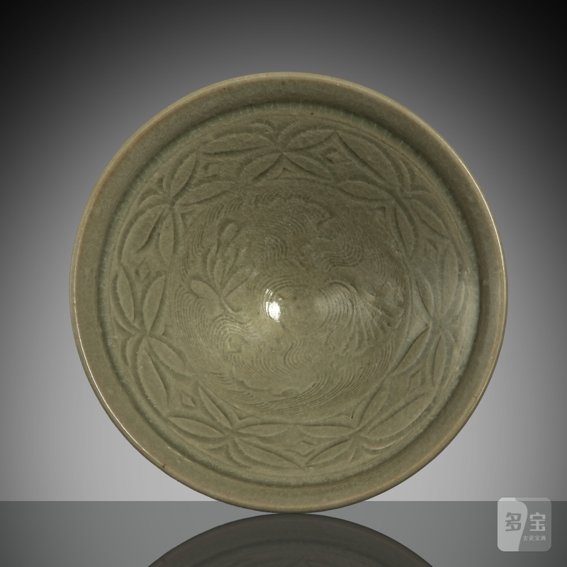 A conical 'Yaozhou' ware celadon bowl with carved decoration